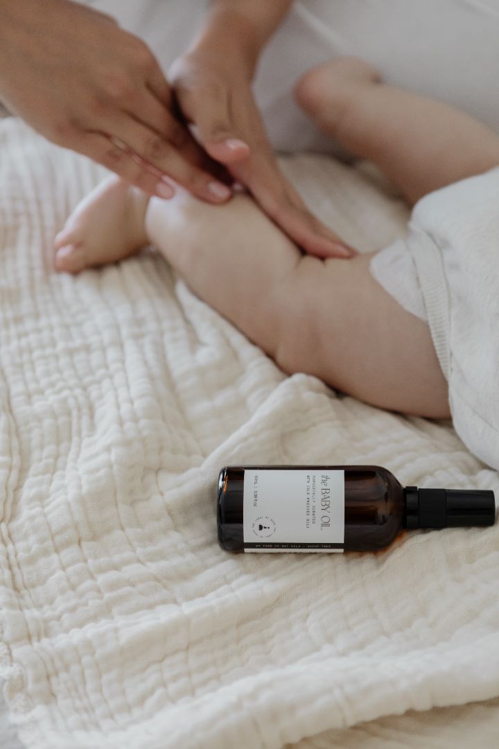 baby having massage with the baby oil